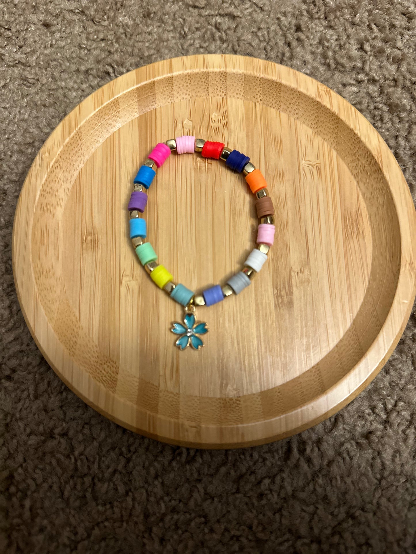 Rainbow with blue flower
